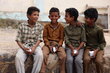 Photo: WFP/Hussam Al-Qalaa. Schoolchildren hold high-energy biscuits from WFP.